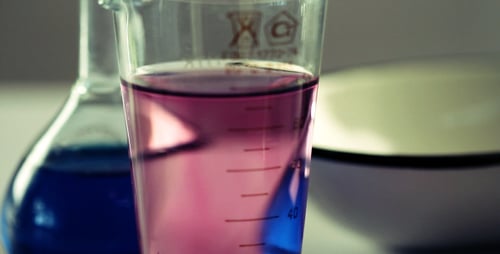 Lab Beakers and Flasks with Colorful Liquids