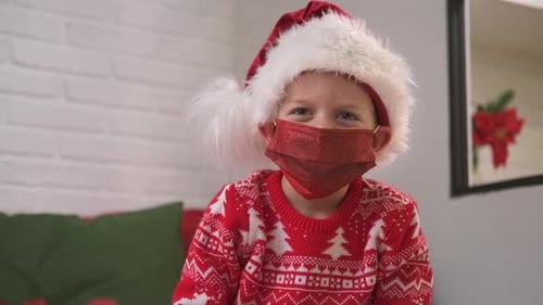Child with Santa Hat and Mask at Christmas