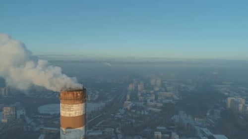 Tall Smoking Chimneys From Industrial Plant City Background