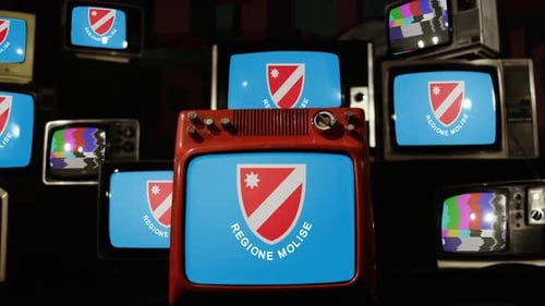 Pile of Retro Televisions Displaying Static and Flags