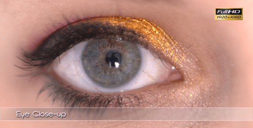 Close-up of Woman's Eye with Golden Eyeshadow