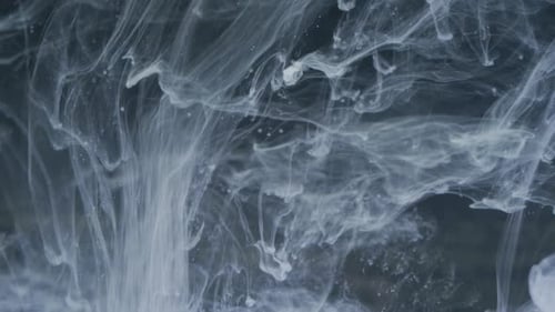 White Smoke Flowing on Black Background