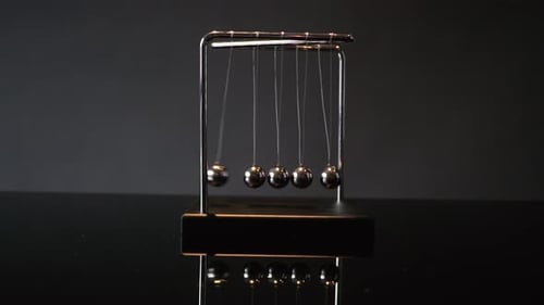 Mesmerizing Kinetic Motion of Newton's Cradle Device