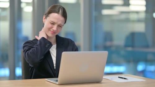 Businesswoman Experiencing Neck Pain at Desk