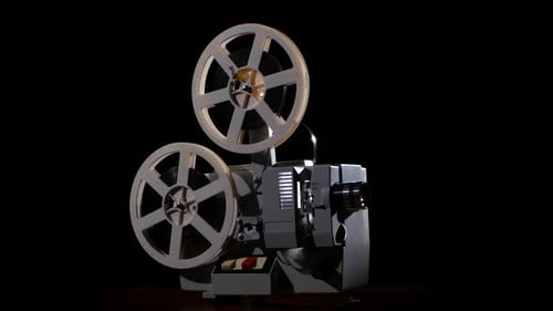 Old Projector Showing Film. Studio Black Background
