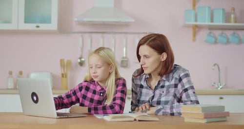 Mom Helping Preteen Daughter with Online School Assignments. Woman Making Homework with School Kid