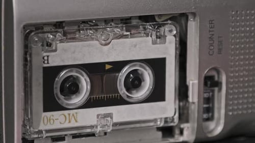 Reels Turning in a Microcassette Tape Recorder