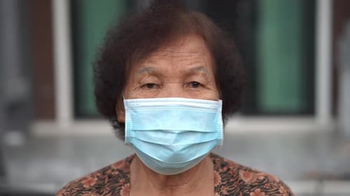 Senior Adult Wearing a Protective Face Mask