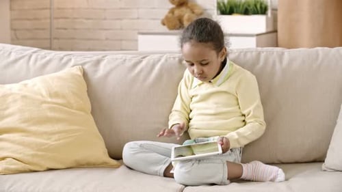 Girl Using Her First Tablet