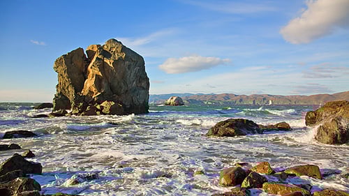 Crashing Waves Around Rock Formation on Beautiful Coast