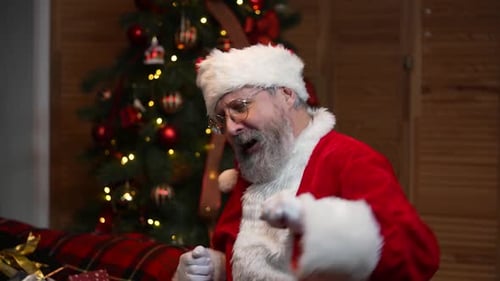 Man Dressed as Santa Claus Dancing Joyfully
