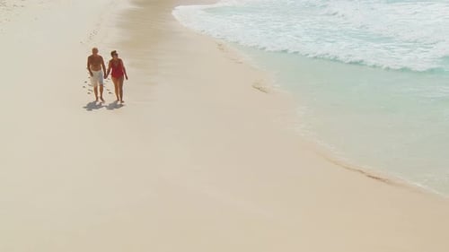 Elderly Couple Walking Towards Camera Along Beach Part Iii