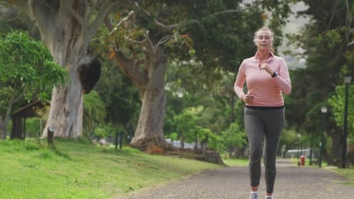 Senior woman running in the park