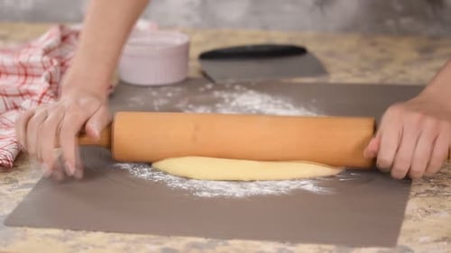 Dough Rolled Thin with Rolling Pin for Baking
