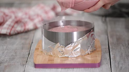 Baker Making Pink Cake in Kitchen at Home