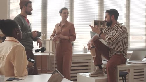 Group of Coworkers Chatting During a Break
