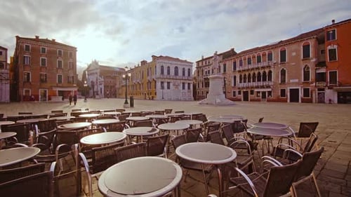 Empty Outdoor Cafe on Central Square with Colorful Buildings