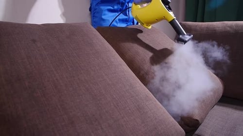 Steam Cleaning a Brown Couch with Machine
