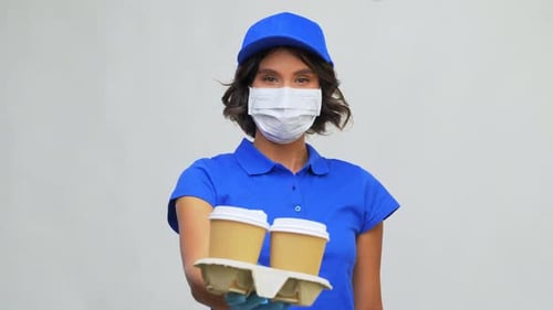 Saleswoman in Face Mask with Takeaway Coffee Cup