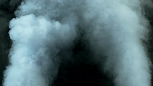 Billowing White Vapor Streams on Black Background