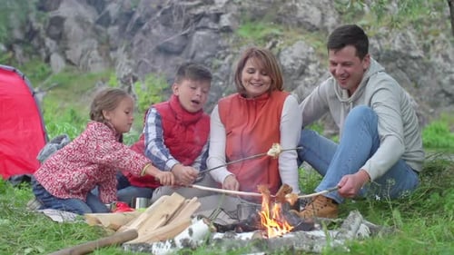 Family Camping Trip Near Campfire