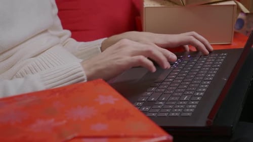 Man hands typing on laptop. Male using laptop on Christmas holidays.