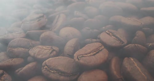 Macro Shot Roasting Coffee Beans Filmed in a Dark Key the Smoke Emanating From the Roasting of