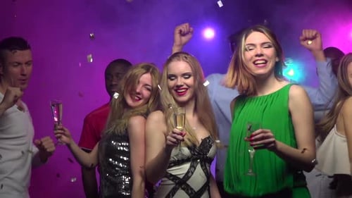 Close-up of Girls Dance with Glass of Champagne. Slow Motion