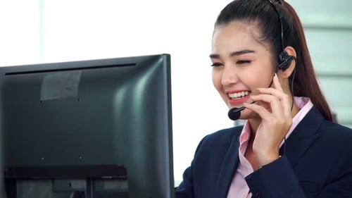 Business People Wearing Headset Working in Office