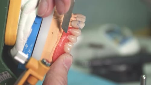Dental Technician Crafting False Teeth Prosthetic Close Up