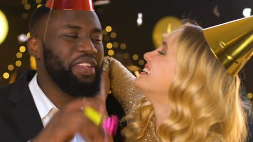 Joyful Multiethnic Couple Laughing at Birthday Party Lady Flirting With Male