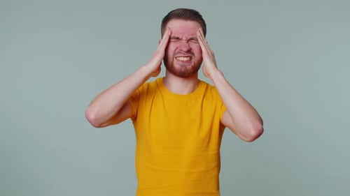 Adult Man Suffering from Headache or Stress