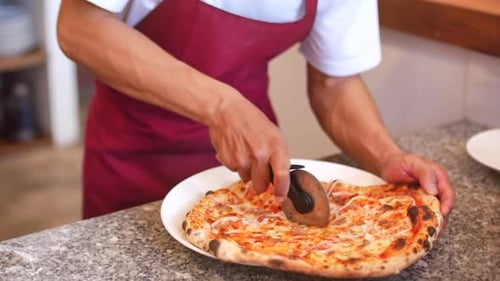 Slow Motion Camera Freshly Baked Pizza on a Tree, Sliced and Served with Delicate Cheese,placed in a