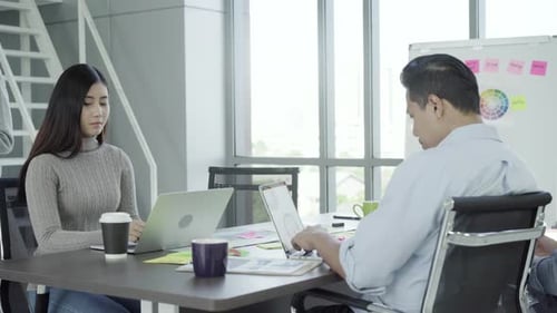 Team Collaborating on Tech Projects in Modern Office