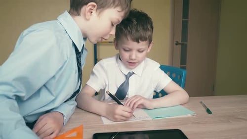 Boys Studying Together Indoors at Home