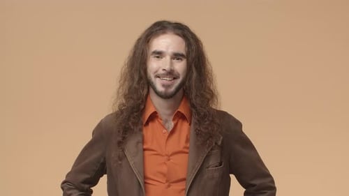 Man with Wavy Hair Smiling and Winking