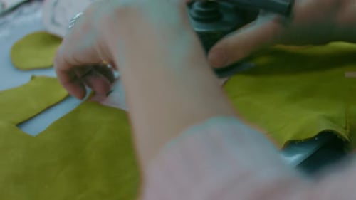 Sewing Machine in a Leather Workshop in Action with Hands Working on a Leather Details for Shoes