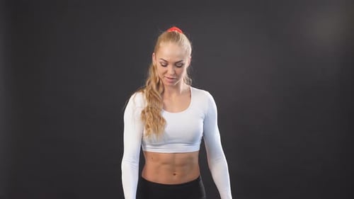 Athletic Young Woman Doing Fitness Workout with Dumbbells