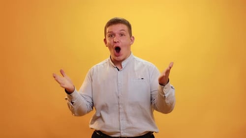 Man Expressing Strong Emotions on Yellow Background