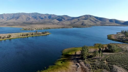 Aerial View of Otay Lake Reservoir with Blue Sky and Mountain