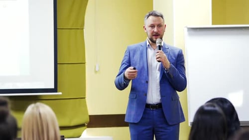 Man Giving Corporate Presentation to Audience