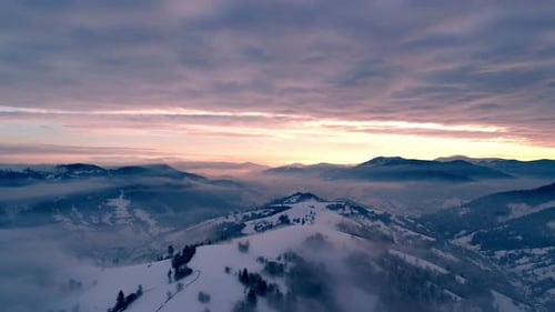Aerial View in Foggy Sunset Winter Mountain