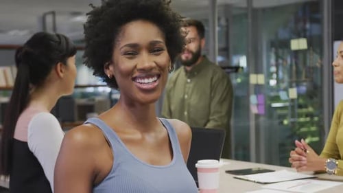 Smiling Woman in Modern Office Workplace Environment