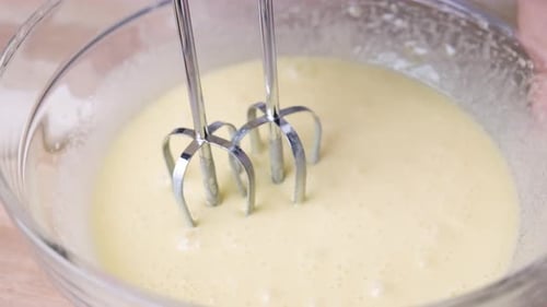 Mixing Batter with Hand Mixer in Bowl