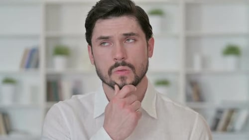 Thoughtful Young Businessman Thinking