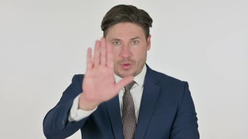 Man in Suit Gestures Stop