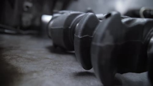 crankshaft of automobile engine lies on the table