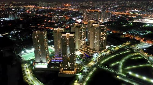 Night city landscape at downtown district. Buildings and traffic.
