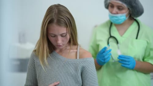 Front View Portrait of Thoughtful Pregnant Woman Getting Coronavirus Vaccine Jab in Hospital