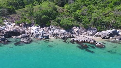Tropical Turquoise Water Meets Rocky Coastline